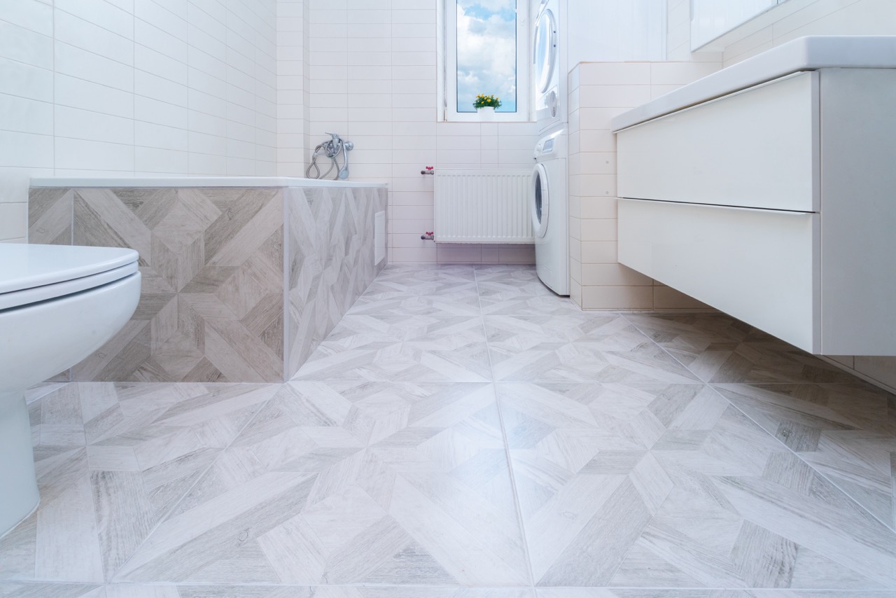 bathroom remodeling bend contractor reviewing blueprints with homeowner
